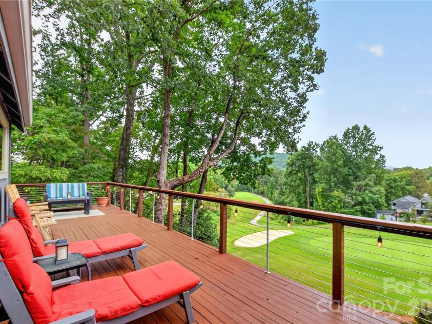 196 Fern Loop, Lake Lure, NC 28746.  MLS# CAR4425558, YatesRealty ID 52036. Golf course view of deck