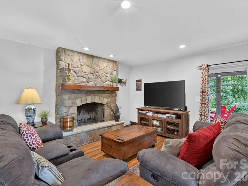 196 Fern Loop, Lake Lure, NC 28746.  MLS# CAR4425558, YatesRealty ID 52036. Lower living room