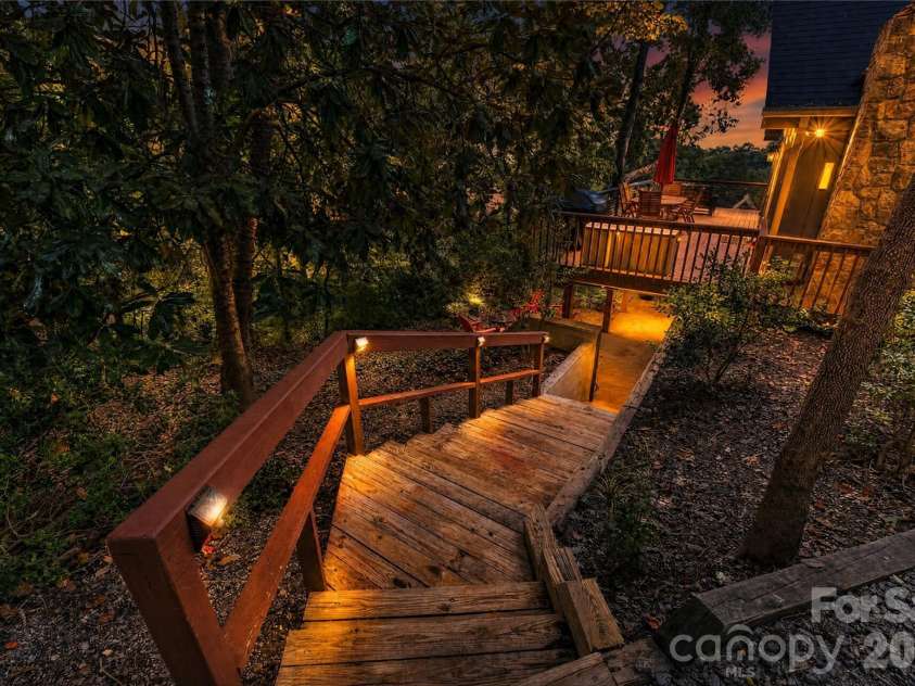196 Fern Loop, Lake Lure, NC 28746.  MLS# CAR4425558, YatesRealty ID 52036. Side of home twilight