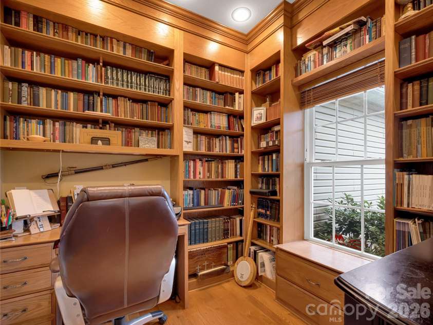 27 & 56 Troy Lane, Tryon, NC 28782.  MLS# CAR4426480, YatesRealty ID 52041. Home Office is an elegant and useful space. Lovely custom shelving and built-ins make this space a special retreat!