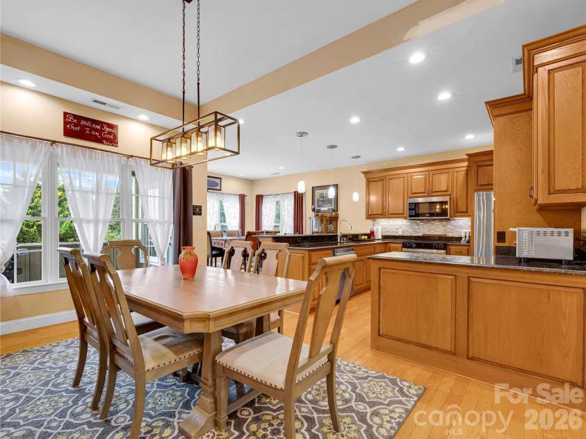 27 & 56 Troy Lane, Tryon, NC 28782.  MLS# CAR4426480, YatesRealty ID 52041. Open concept floor plan includes a dining room, kitchen and a breakfast/casual dining area.