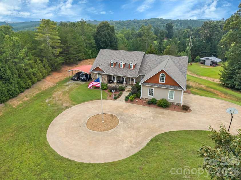27 & 56 Troy Lane, Tryon, NC 28782.  MLS# CAR4426480, YatesRealty ID 52041. This is an absolutely move-in ready property, it has been beautifully maintained inside and out, including new roofs. Recently cleared areas are scheduled for re-seeding this fall.