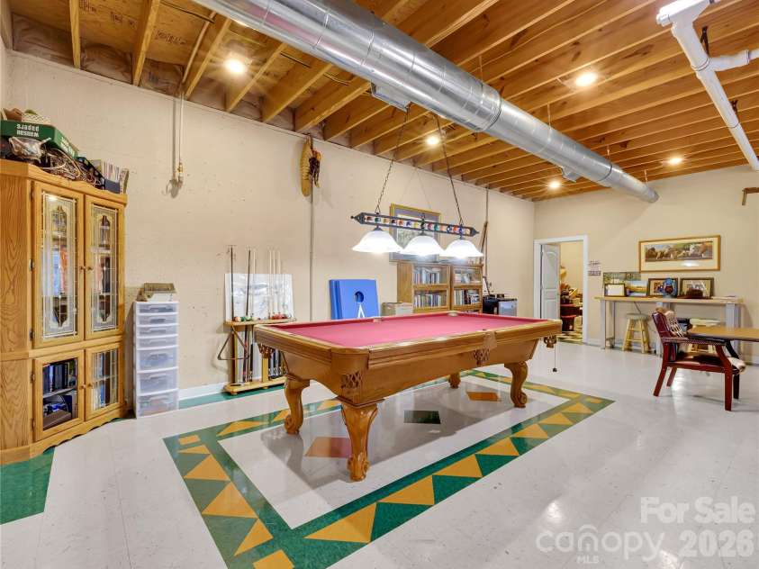 27 & 56 Troy Lane, Tryon, NC 28782.  MLS# CAR4426480, YatesRealty ID 52041. This massive space is perfect for entertaining and family activities.