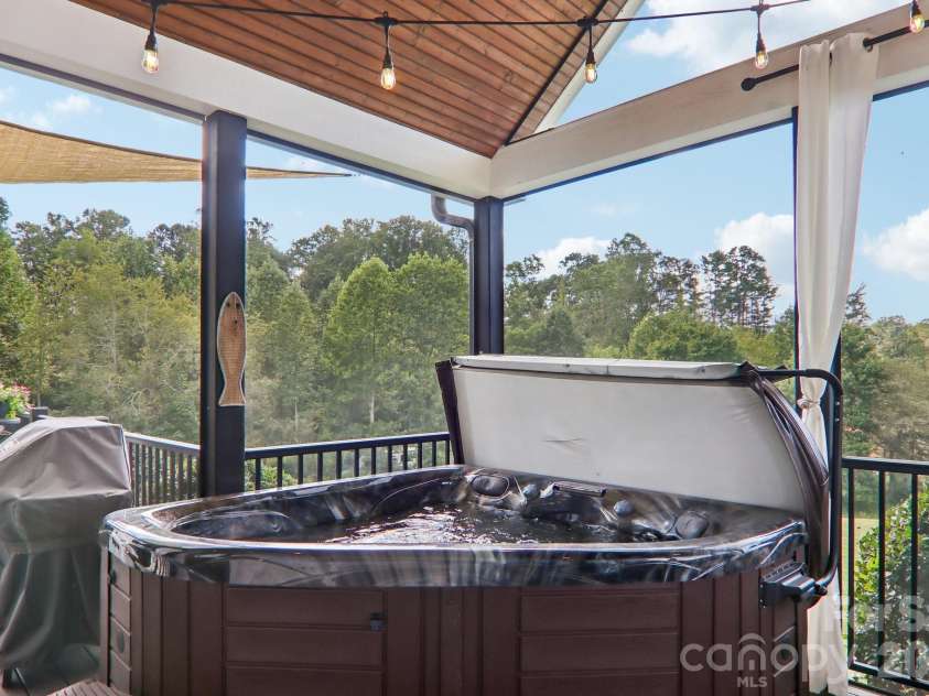 107 New Pinner Place, Arden, NC 28704.  MLS# CAR4426585, YatesRealty ID 52049. Back Porch Bath Tub