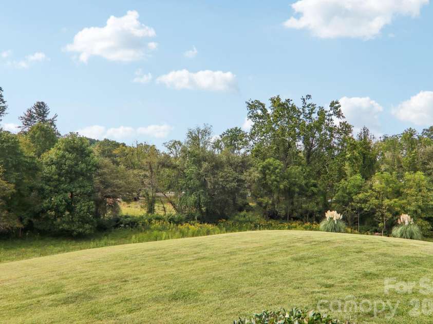 107 New Pinner Place, Arden, NC 28704.  MLS# CAR4426585, YatesRealty ID 52049. One Acre rolling back yard