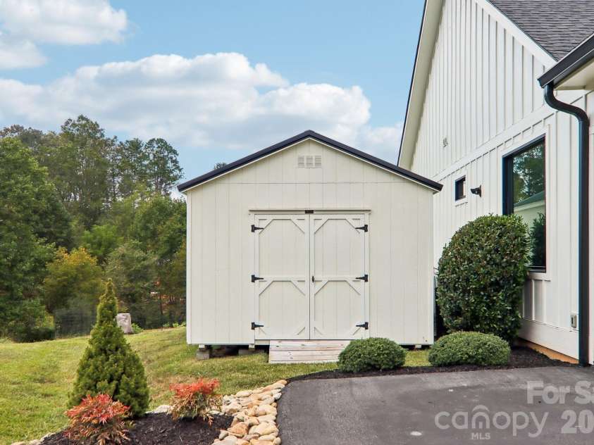 107 New Pinner Place, Arden, NC 28704.  MLS# CAR4426585, YatesRealty ID 52049. Shed By the garage