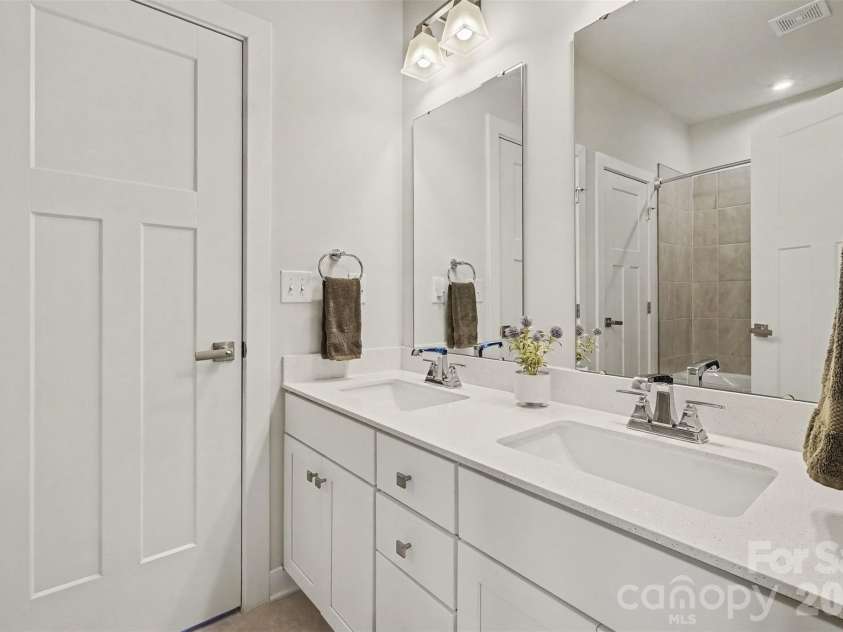 6513 Cumberland Drive, Harrisburg, NC 28075.  MLS# CAR4426198, YatesRealty ID 52070. Hall bath, double sinks