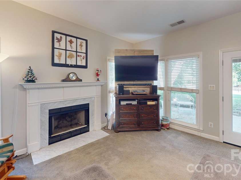 1606 Thornblade Ridge Drive, Matthews, NC 28105.  MLS# CAR4424953, YatesRealty ID 52073. Den with access to outside patio