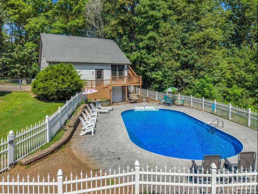 215 Hillcrest Drive, Columbus, NC 28722.  MLS# CAR4424908, YatesRealty ID 52075. In ground pool with pool house
