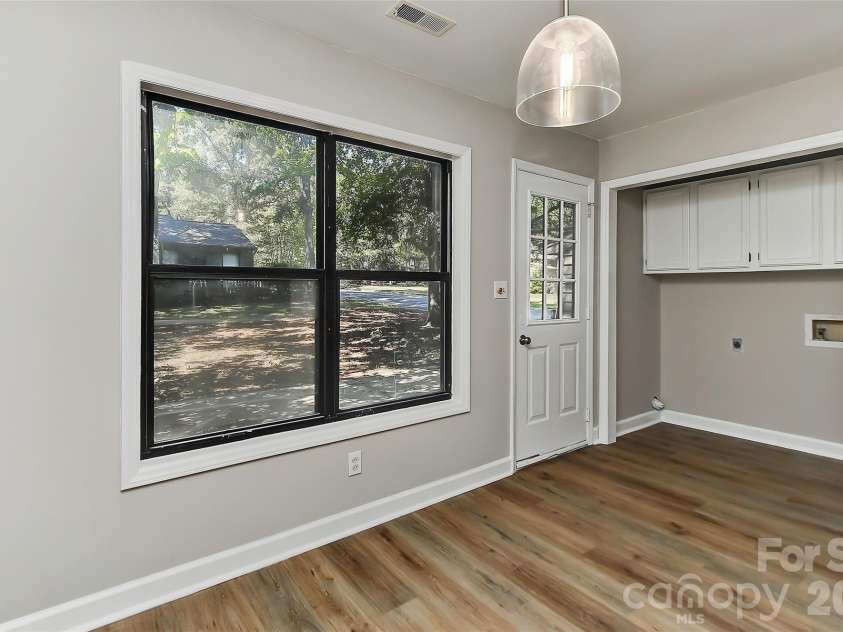 1023 Cranberry Circle, Fort Mill, SC 29715.  MLS# CAR4426644, YatesRealty ID 52079. Back door & laundry area with storage cabinets.