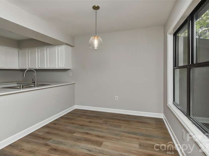 1023 Cranberry Circle, Fort Mill, SC 29715.  MLS# CAR4426644, YatesRealty ID 52079. Dining room with new light.