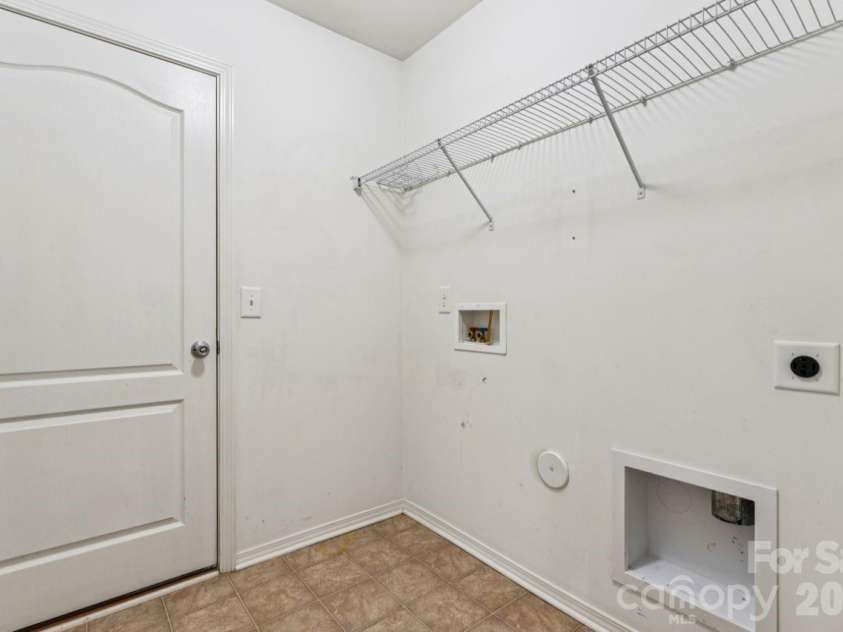 7628 Jenny Ann Drive, Charlotte, NC 28216.  MLS# CAR4426571, YatesRealty ID 52093. Laundry Room by Garage