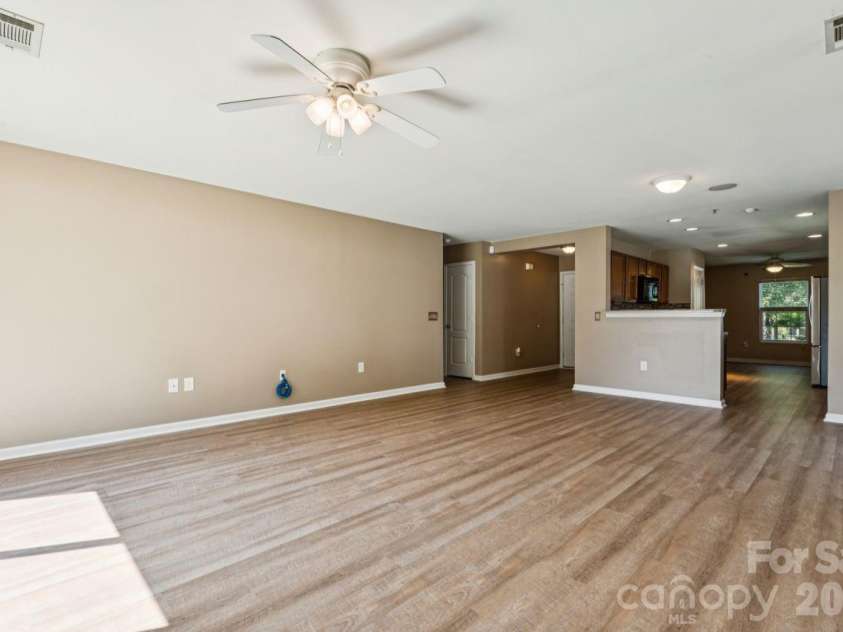 7628 Jenny Ann Drive, Charlotte, NC 28216.  MLS# CAR4426571, YatesRealty ID 52093. Living Room open to Kitchen