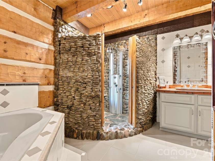 237 Murdock Road, Bakersville, NC 28705.  MLS# CAR4425998, YatesRealty ID 52099. Rock Shower