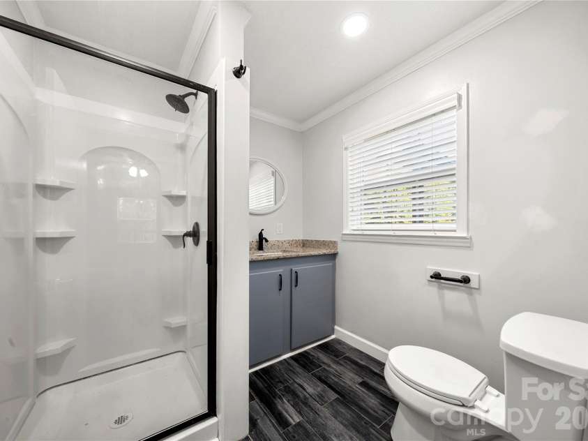 109 Woodside Avenue, Gastonia, NC 28054.  MLS# CAR4426139, YatesRealty ID 52105. Main level primary bathroom