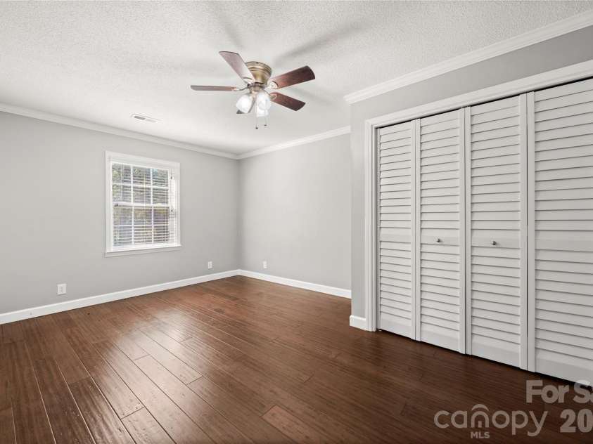 109 Woodside Avenue, Gastonia, NC 28054.  MLS# CAR4426139, YatesRealty ID 52105. Main level secondary bedroom boasting two closets