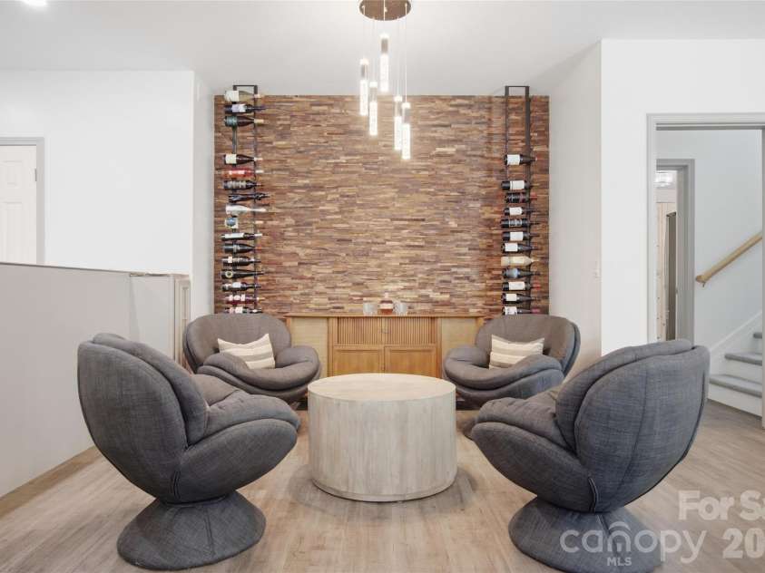 5134 Cressingham Drive, Indian Land, SC 29707.  MLS# CAR4425302, YatesRealty ID 52112. Wine wall and seating area in basement