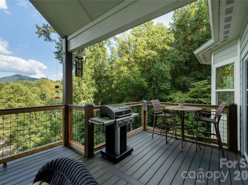 110 Quail Mountain Lane, Waynesville, NC 28786.  MLS# CAR4424241, YatesRealty ID 52123. Main level grilling deck