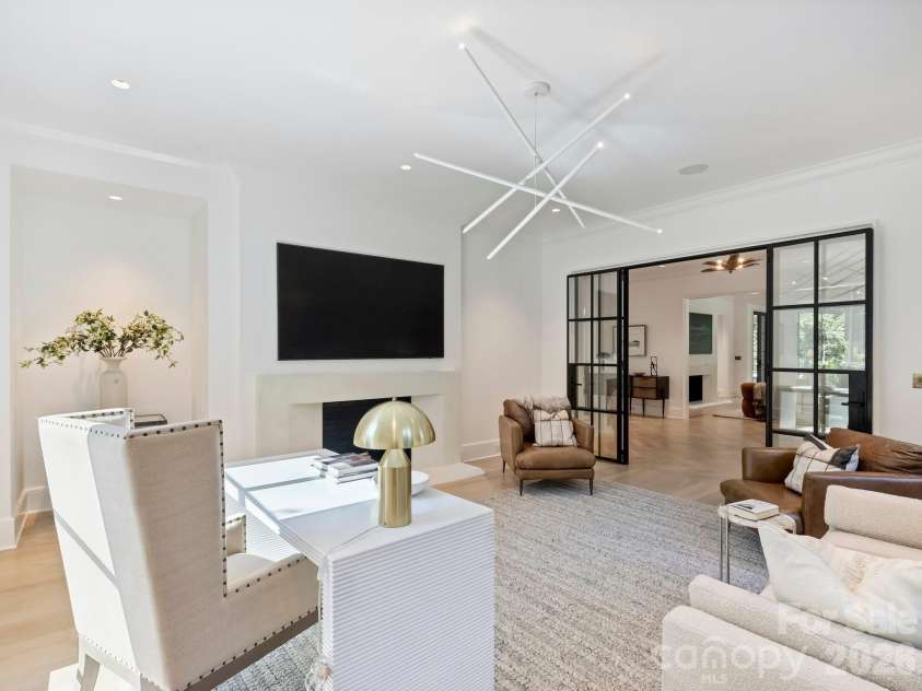 600 Hermitage Road, Charlotte, NC 28207.  MLS# CAR4422657, YatesRealty ID 52142. Custom steel window wall with doors for privacy