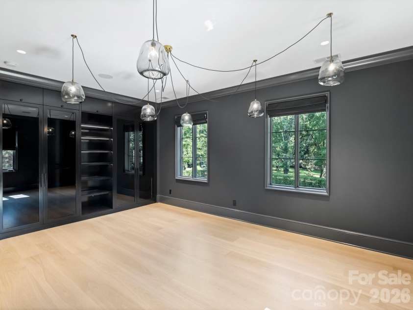 600 Hermitage Road, Charlotte, NC 28207.  MLS# CAR4422657, YatesRealty ID 52142. Upper level Guest Suite 1 with fun modern custom closet system