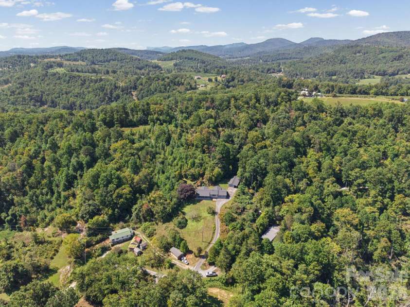 727 Lyda Road, Hendersonville, NC 28792.  MLS# CAR4426316, YatesRealty ID 52153. Arial view of home