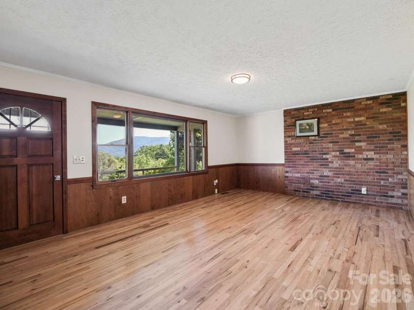 727 Lyda Road, Hendersonville, NC 28792.  MLS# CAR4426316, YatesRealty ID 52153. Living room with large windows