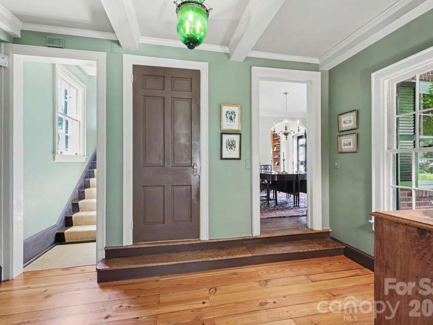 1401 Queens Road, Charlotte, NC 28207.  MLS# CAR4417618, YatesRealty ID 52181. Hall with back staircase