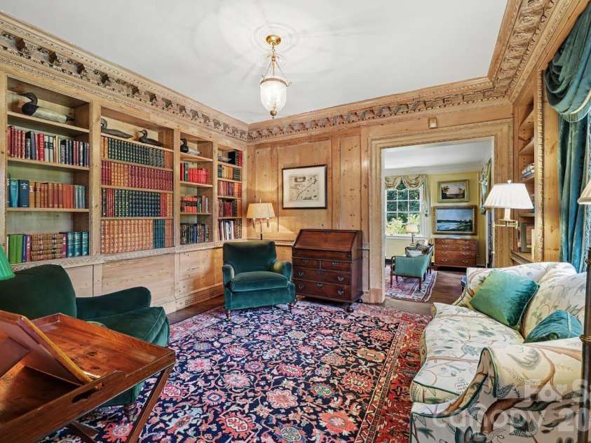 1401 Queens Road, Charlotte, NC 28207.  MLS# CAR4417618, YatesRealty ID 52181. Library with english paneling and millwork