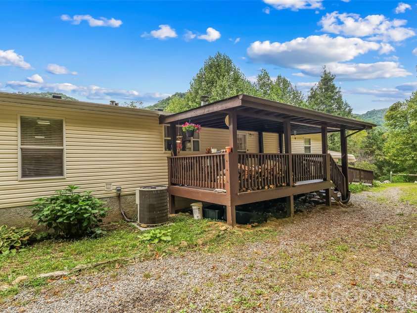 245 Merry Way, Clyde, NC 28721.  MLS# CAR4419042, YatesRealty ID 52197. Back of home - easy drive-up for unloading