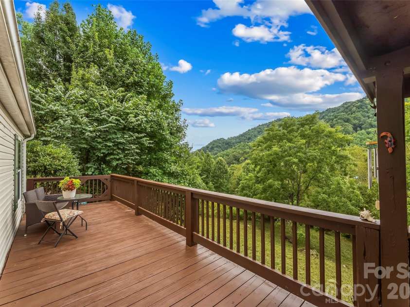245 Merry Way, Clyde, NC 28721.  MLS# CAR4419042, YatesRealty ID 52197. Beautiful mountain views from your covered porch