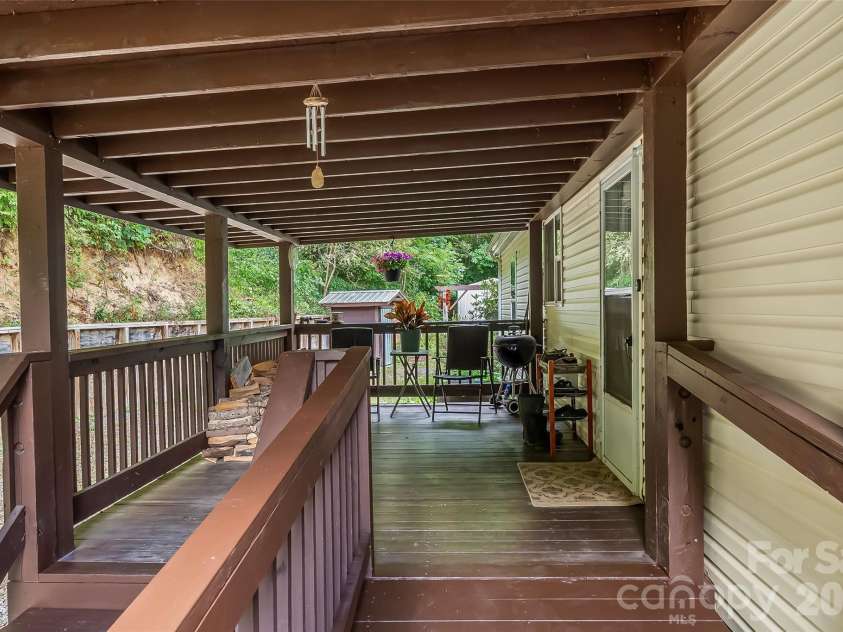 245 Merry Way, Clyde, NC 28721.  MLS# CAR4419042, YatesRealty ID 52197. Covered back porch