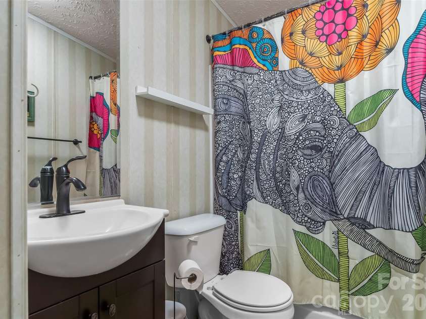 245 Merry Way, Clyde, NC 28721.  MLS# CAR4419042, YatesRealty ID 52197. Full second bathroom