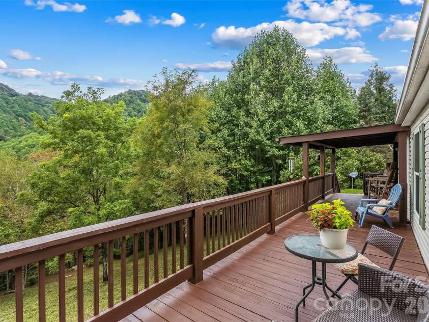 245 Merry Way, Clyde, NC 28721.  MLS# CAR4419042, YatesRealty ID 52197. Gorgeous views from covered and uncovered porches