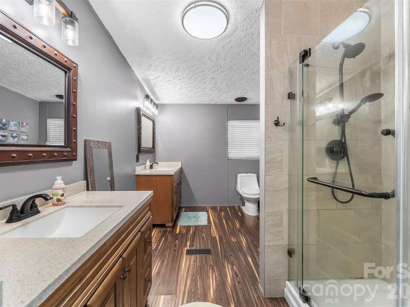 245 Merry Way, Clyde, NC 28721.  MLS# CAR4419042, YatesRealty ID 52197. Large updated primary bathroom
