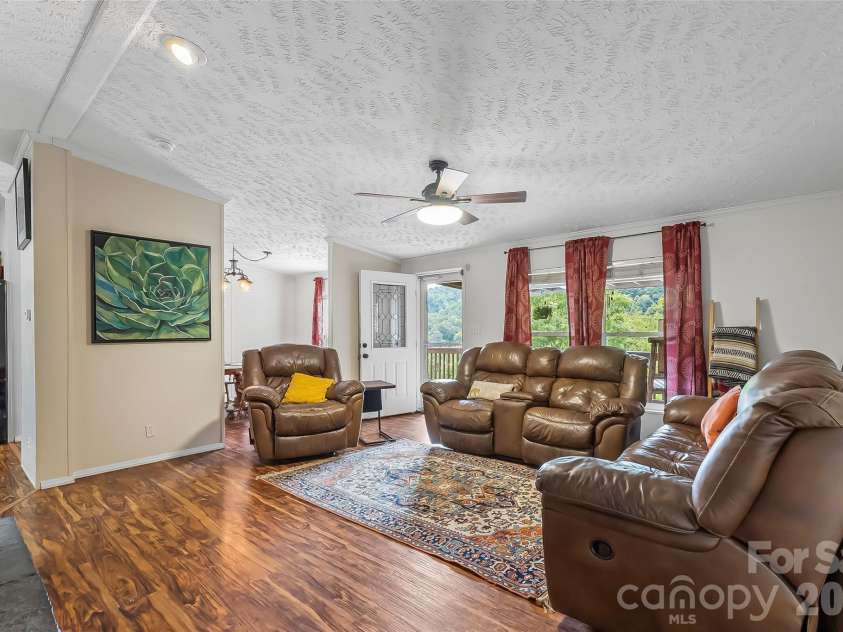 245 Merry Way, Clyde, NC 28721.  MLS# CAR4419042, YatesRealty ID 52197. Open layout throughout main living spaces