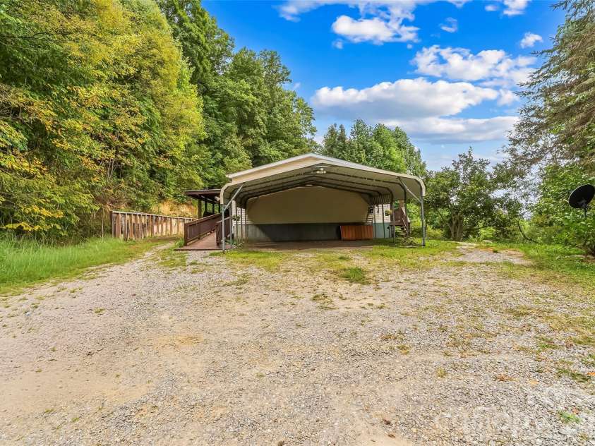 245 Merry Way, Clyde, NC 28721.  MLS# CAR4419042, YatesRealty ID 52197. Oversized carport and parking