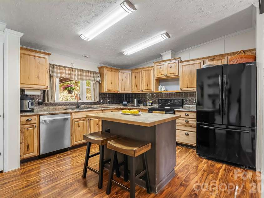 245 Merry Way, Clyde, NC 28721.  MLS# CAR4419042, YatesRealty ID 52197. Spacious updated kitchen
