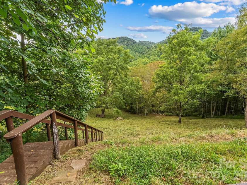 245 Merry Way, Clyde, NC 28721.  MLS# CAR4419042, YatesRealty ID 52197. Stairs to the pasture area