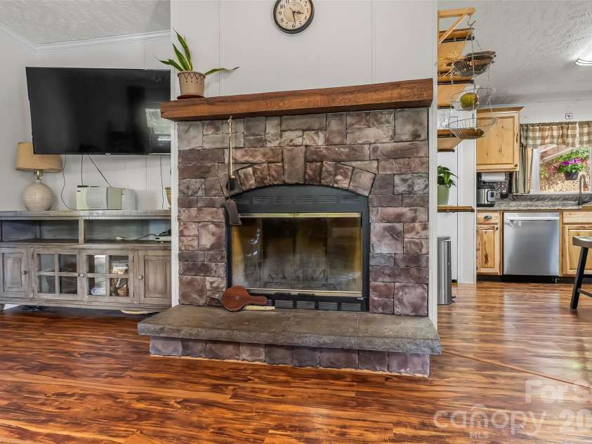 245 Merry Way, Clyde, NC 28721.  MLS# CAR4419042, YatesRealty ID 52197. Wood burning fireplace
