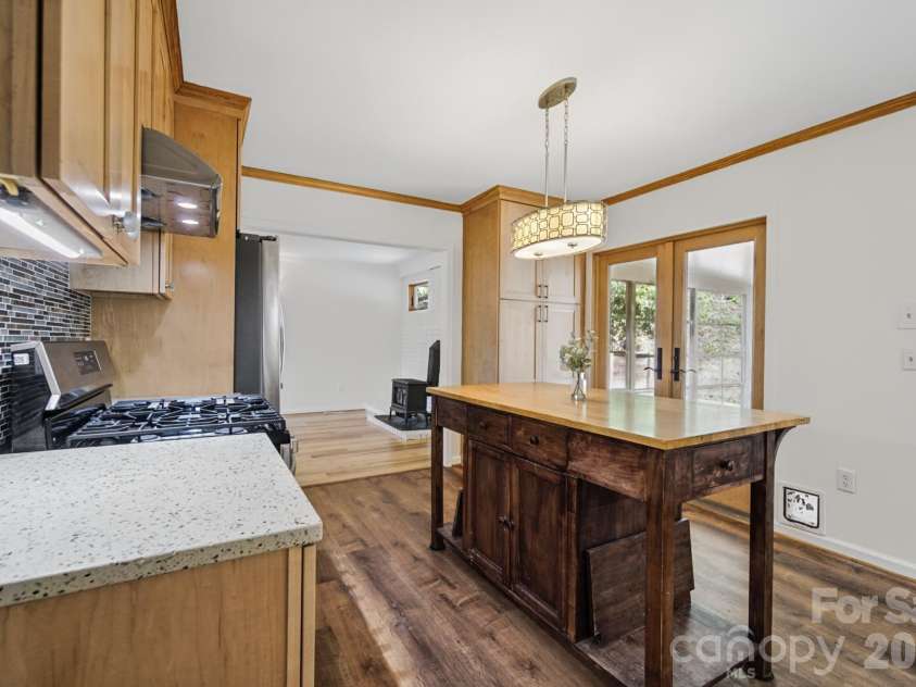 35 Clement Drive, Asheville, NC 28805.  MLS# CAR4422265, YatesRealty ID 52299. Kitchen opens into sunroom