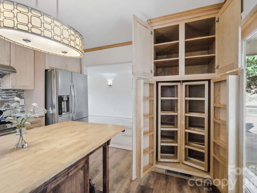 35 Clement Drive, Asheville, NC 28805.  MLS# CAR4422265, YatesRealty ID 52299. Very cool pull-out cabinetry/shelving