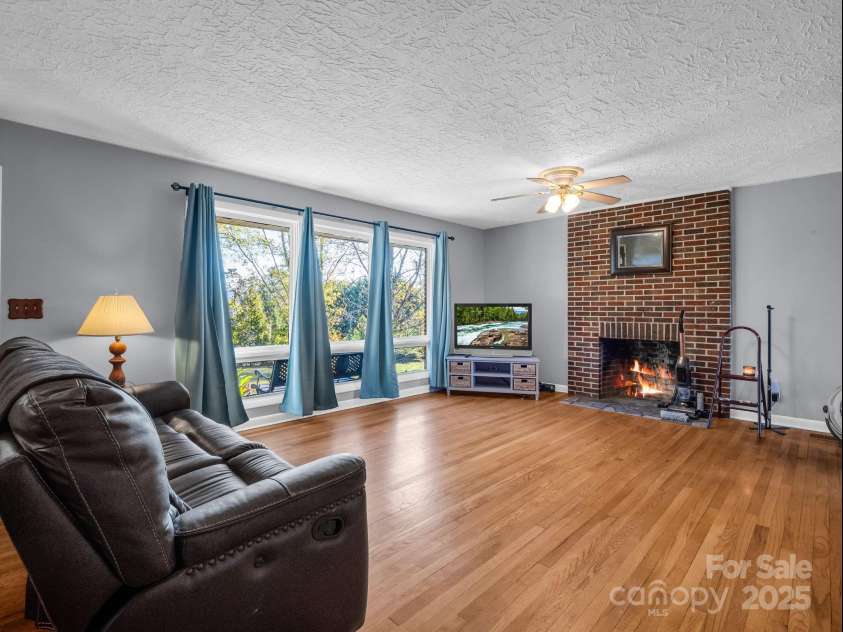 290 Stepp Mill Road, Hendersonville, NC 28792.  MLS# CAR4317367, YatesRealty ID 523. Living Room w/ Wood Burning Fireplace
