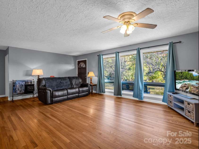 290 Stepp Mill Road, Hendersonville, NC 28792.  MLS# CAR4317367, YatesRealty ID 523. Living Room w/ Wood Large Picture Window