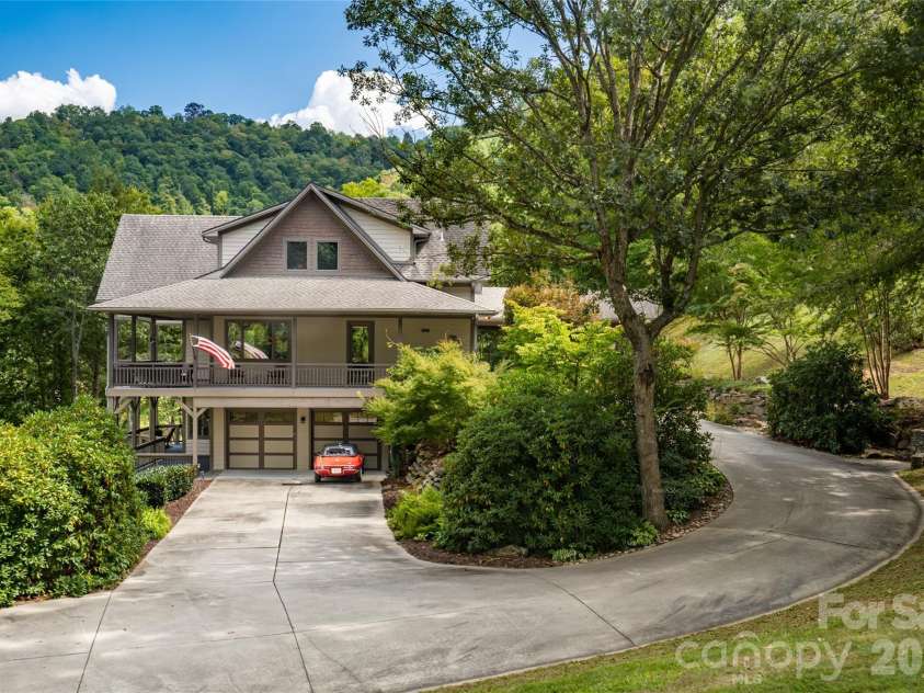 538 Celebration Cove, Clyde, NC 28721.  MLS# CAR4424841, YatesRealty ID 52304. Discretely placed lower level garage assures you'll never have a garage door interrupting your curb appeal