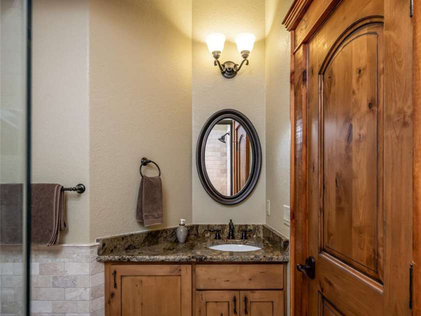 538 Celebration Cove, Clyde, NC 28721.  MLS# CAR4424841, YatesRealty ID 52304. Ensuite guest bath #2 with tile shower/bath