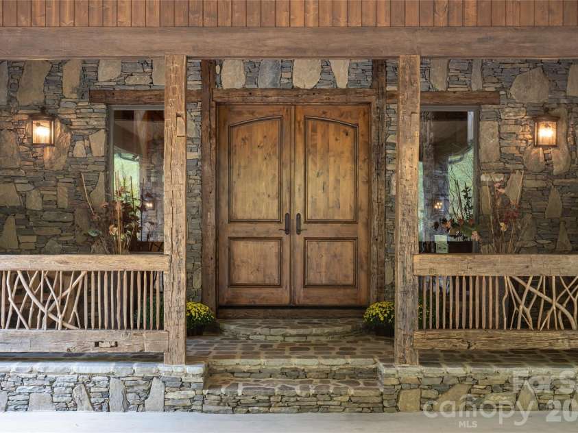 538 Celebration Cove, Clyde, NC 28721.  MLS# CAR4424841, YatesRealty ID 52304. Grande entry from the porte cochere