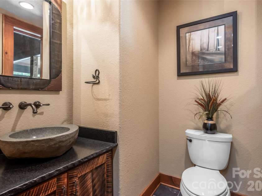 538 Celebration Cove, Clyde, NC 28721.  MLS# CAR4424841, YatesRealty ID 52304. Main level powder room