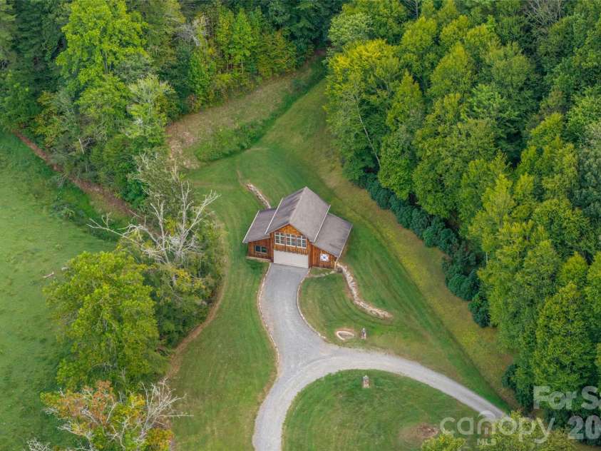 538 Celebration Cove, Clyde, NC 28721.  MLS# CAR4424841, YatesRealty ID 52304. Power could easily be supplied to the barn to make it even more appealing as a working shop or guest home. Equestrian facility anyone?