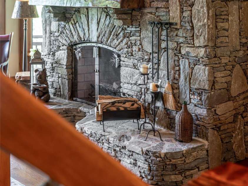 538 Celebration Cove, Clyde, NC 28721.  MLS# CAR4424841, YatesRealty ID 52304. Wood burning floor to ceiling fireplace- a masterpiece!