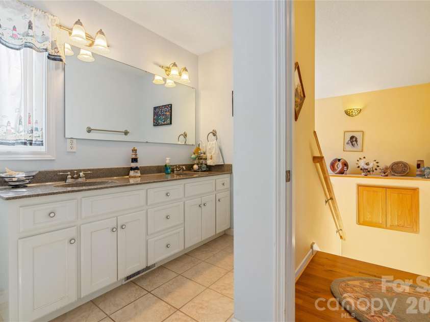 296 Acorn Lane, Rutherfordton, NC 28139.  MLS# CAR4427187, YatesRealty ID 52307. Double vanity/stairwell